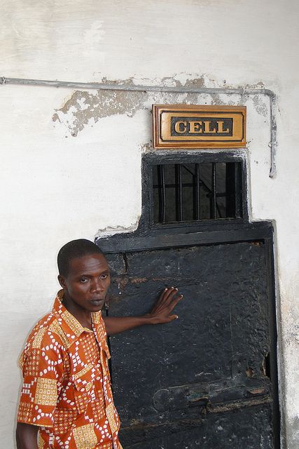 Guide by Entrance to Slave Cell - Cape Coast Castle - Cape Coast - Ghana