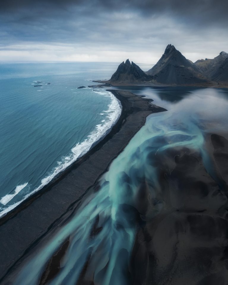 Glacial rivers and black sand beaches on the coast of Iceland [OC][5287X6609] insta @zachtesta